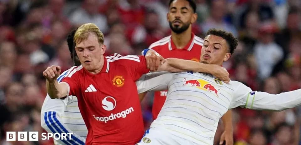 Two players clashing during a football match