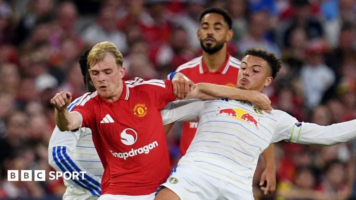 Two players clashing during a football match