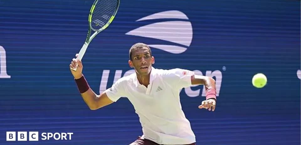 Player hitting a tennis ball during a match