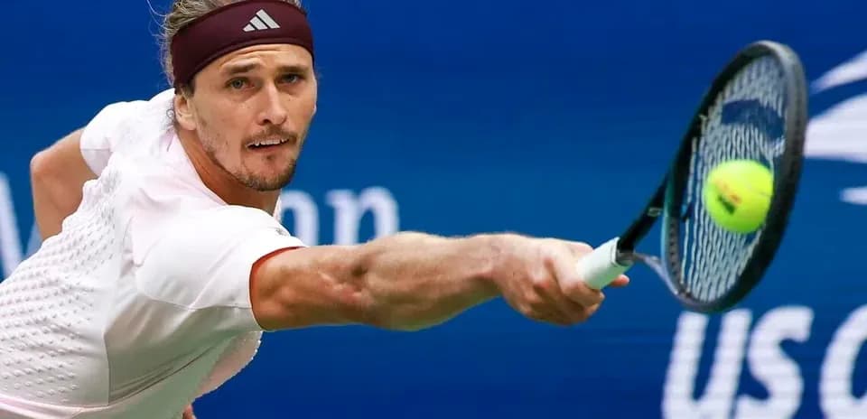 Player hitting a tennis ball during match