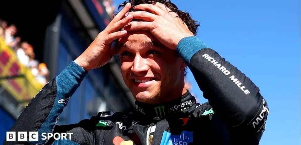 Driver celebrating after a race with hands on head
