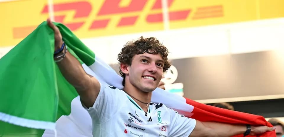 Driver celebrating with Italian flag after race
