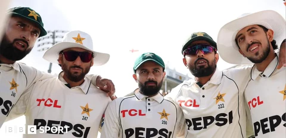 Pakistani cricket players posing together on field