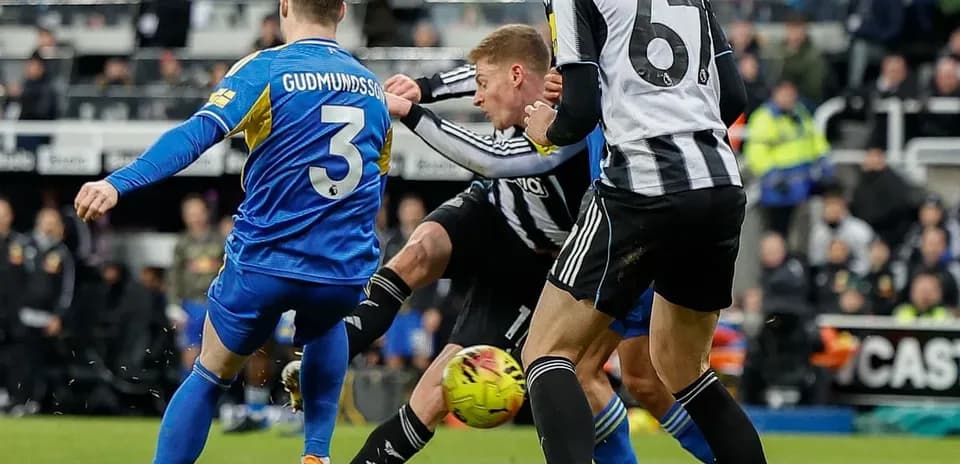 Leeds player tackles Newcastle opponent during match