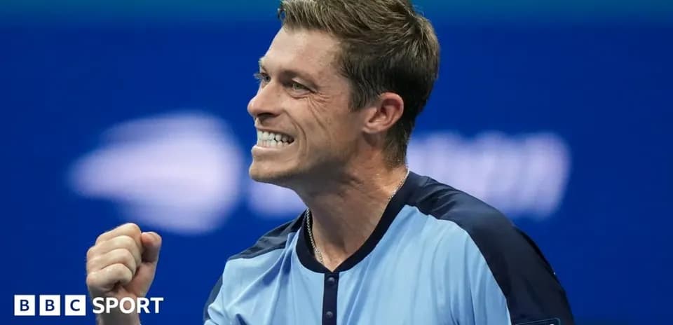Tennis player celebrating victory during a match