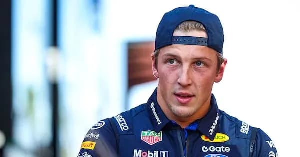 Racing driver in team uniform during event