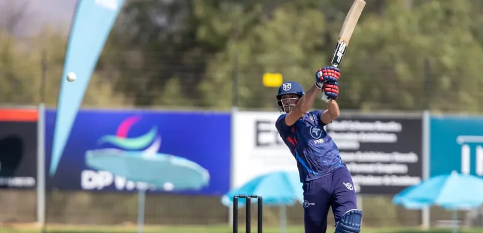 Batsman hitting a ball during cricket match