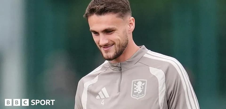 Player in Aston Villa training gear smiling during session