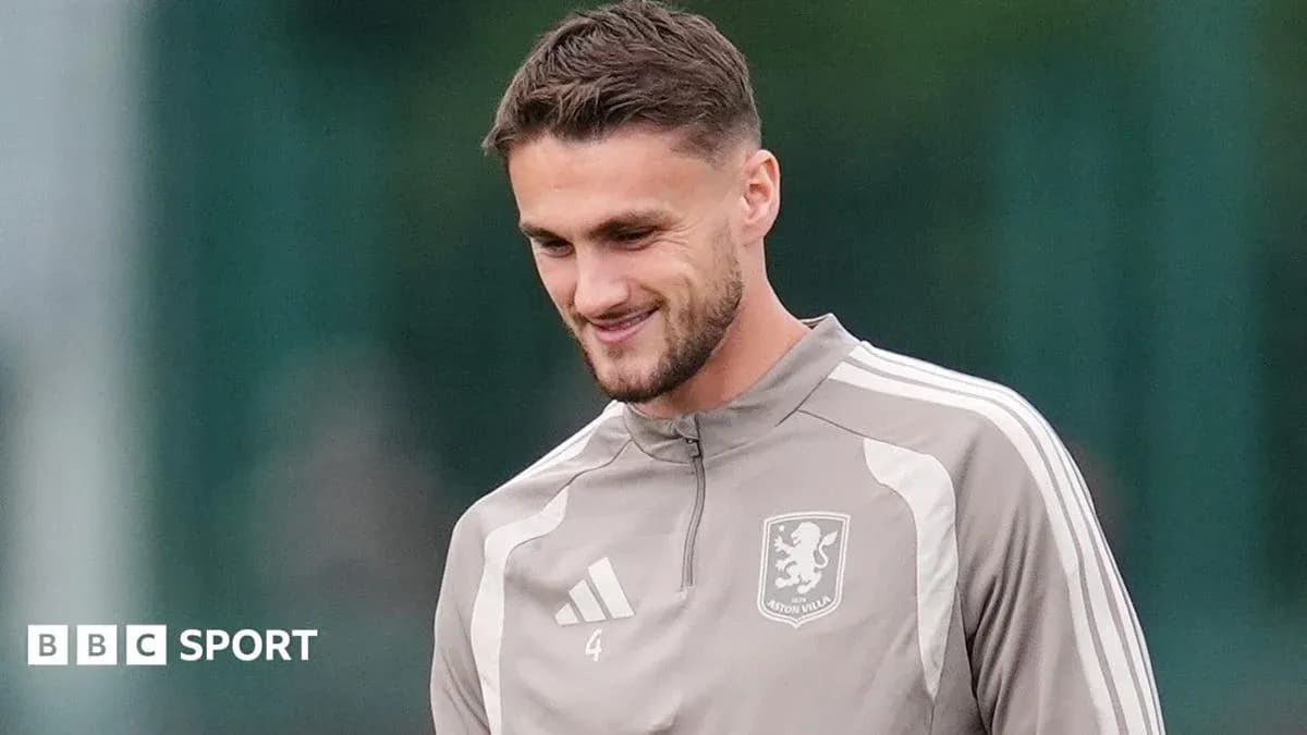 Player in Aston Villa training gear smiling during session