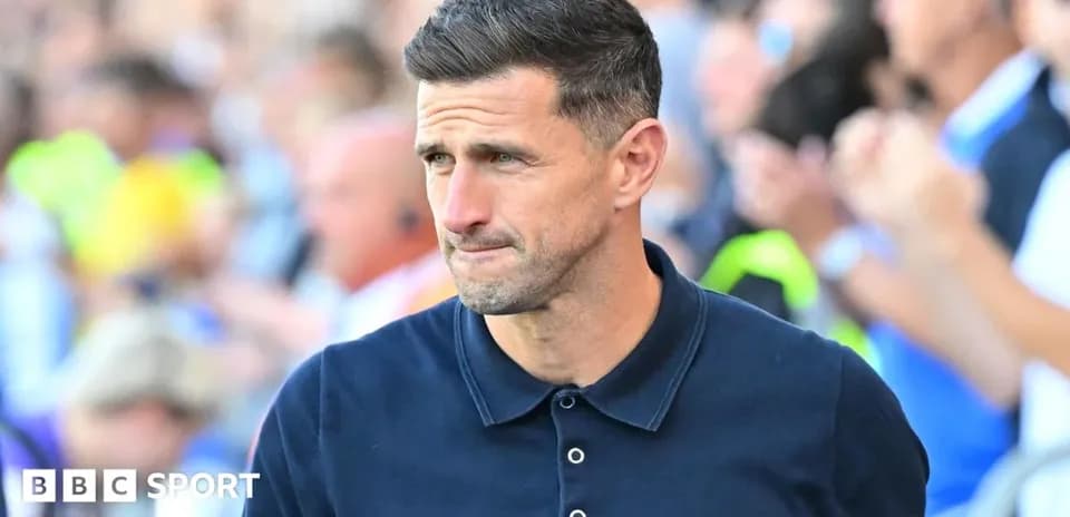 Manager walking on the sideline during match