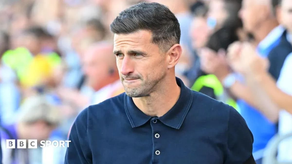 Manager walking on the sideline during match