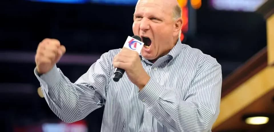 Man passionately speaking into microphone at event