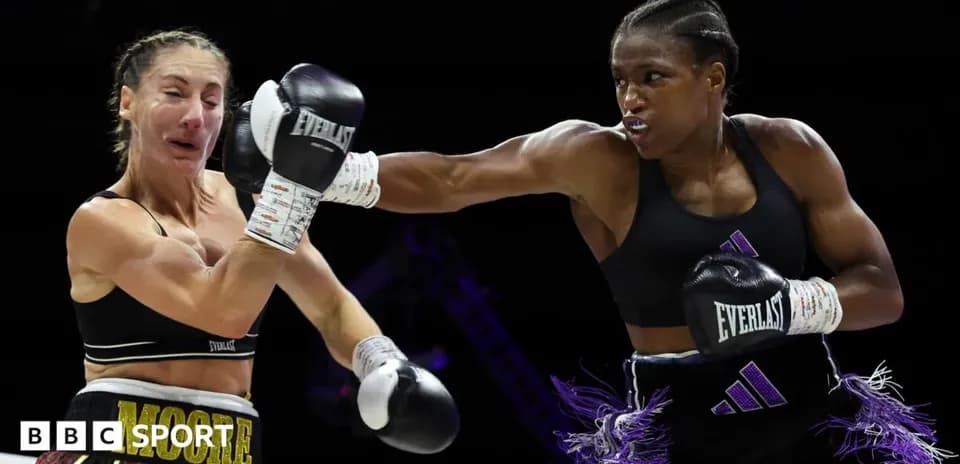 Boxers competing in a match, one throwing a punch