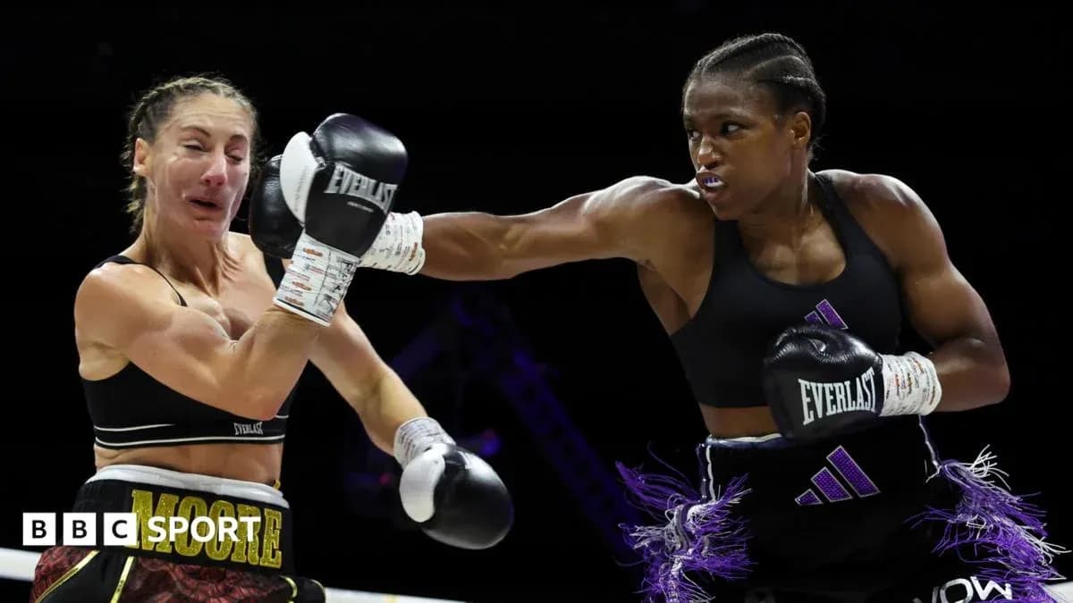Boxers competing in a match, one throwing a punch