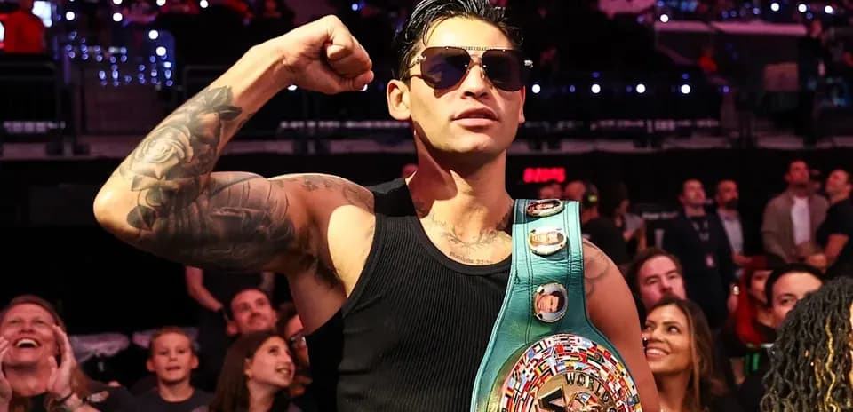 Boxer posing with WBC championship belt in audience