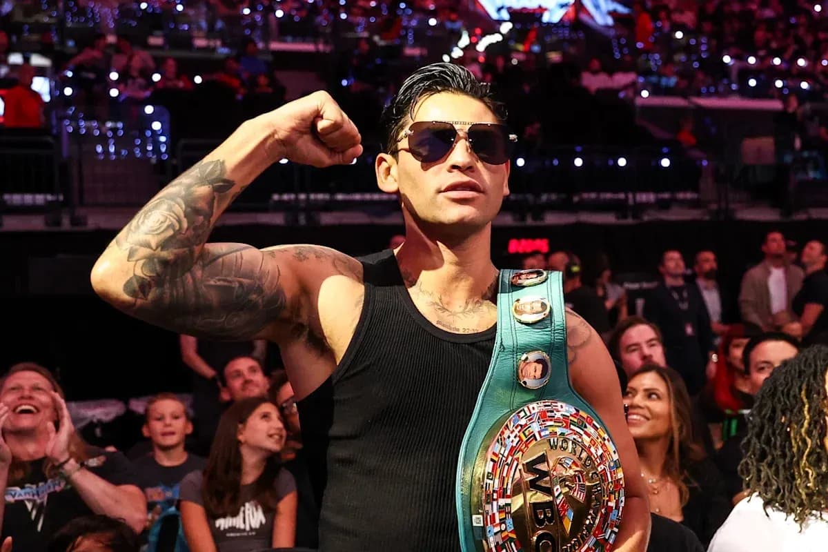 Boxer posing with WBC championship belt in audience