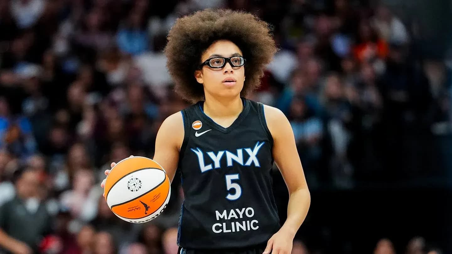 Player holding basketball during game for Lynx