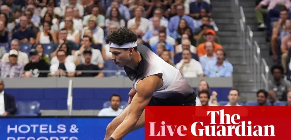 Player serving during a tennis match with spectators
