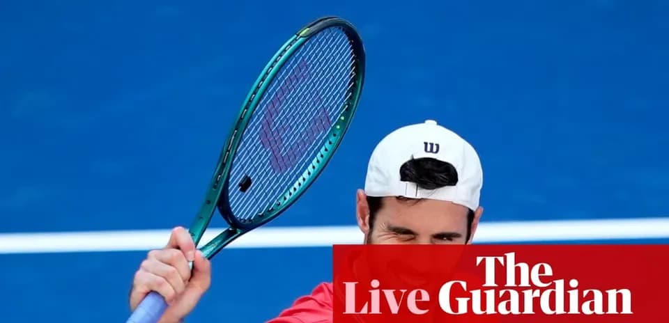 Tennis player celebrating with racket on court