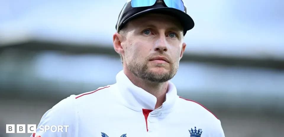Cricketer in England kit looking serious on field