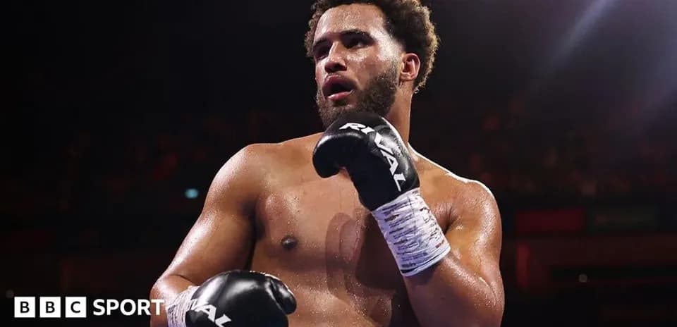 Boxer in gloves posing after a match