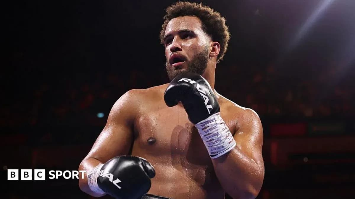 Boxer in gloves posing after a match