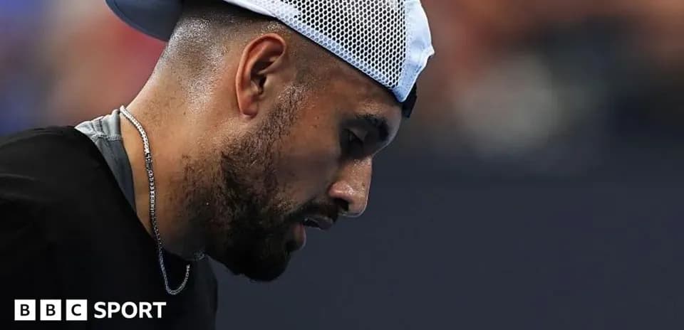 Tennis player looking down during a match