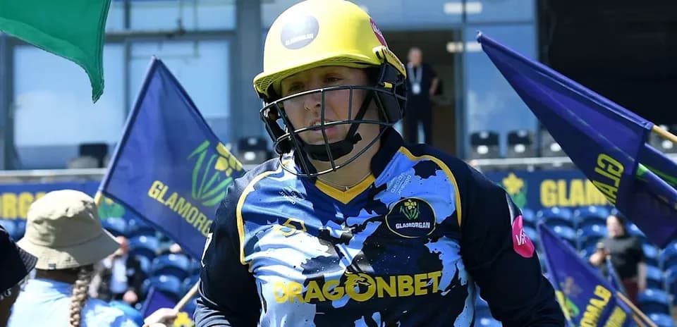 Cricketer in Glamorgan jersey entering the field