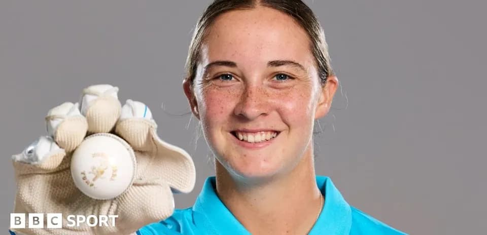 Player holding a cricket ball with gloves