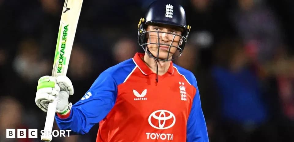 Batsman celebrating with bat during cricket match