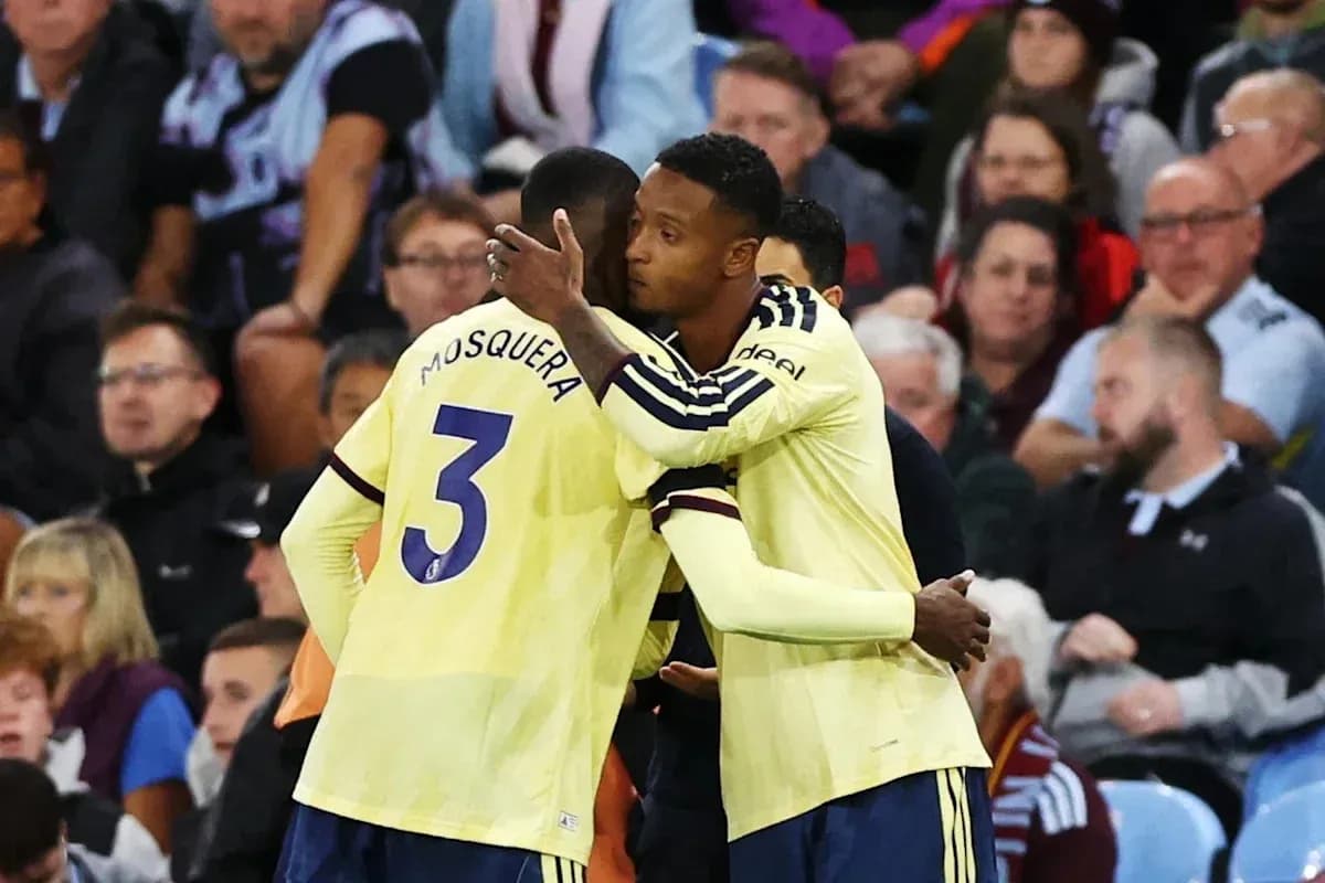 Players embracing on the sidelines during a match