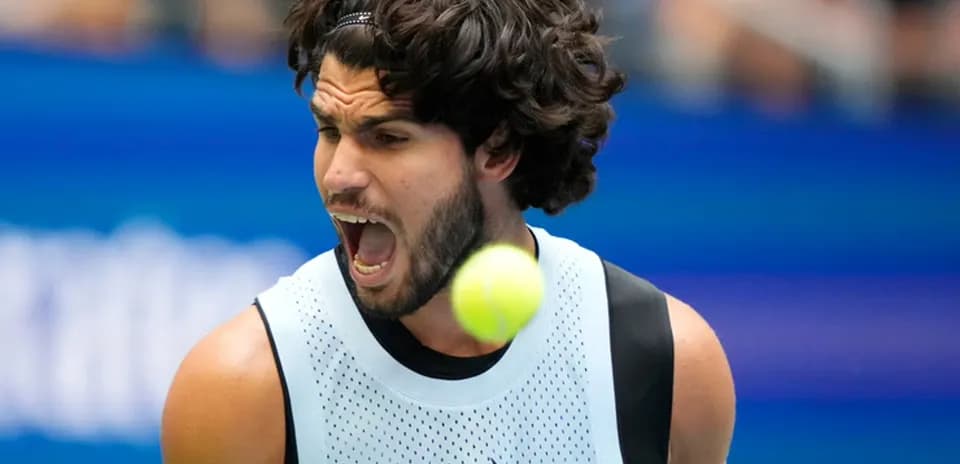 Player celebrating a point during tennis match