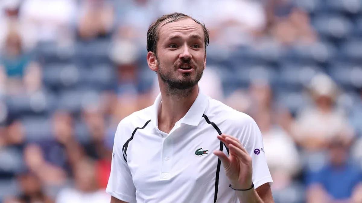 Tennis player gesturing during match on court