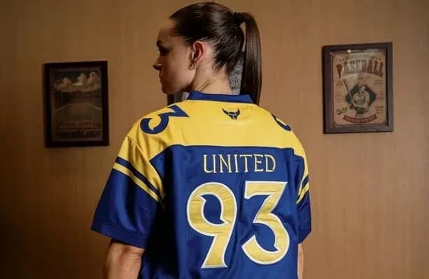 Person wearing a blue and yellow jersey with 'United' and number 93