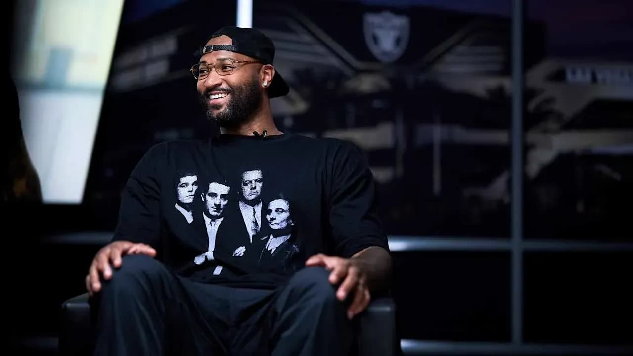 Player sitting in interview setting, wearing graphic t-shirt