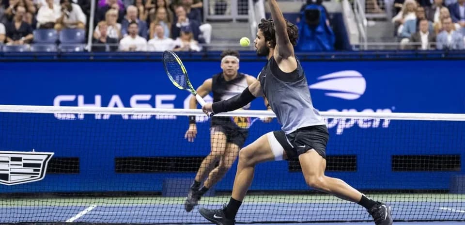 Player returning a tennis ball during a match