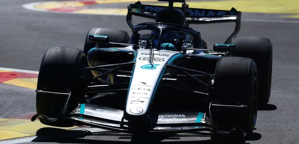 Mercedes Formula 1 car navigating a turn on track