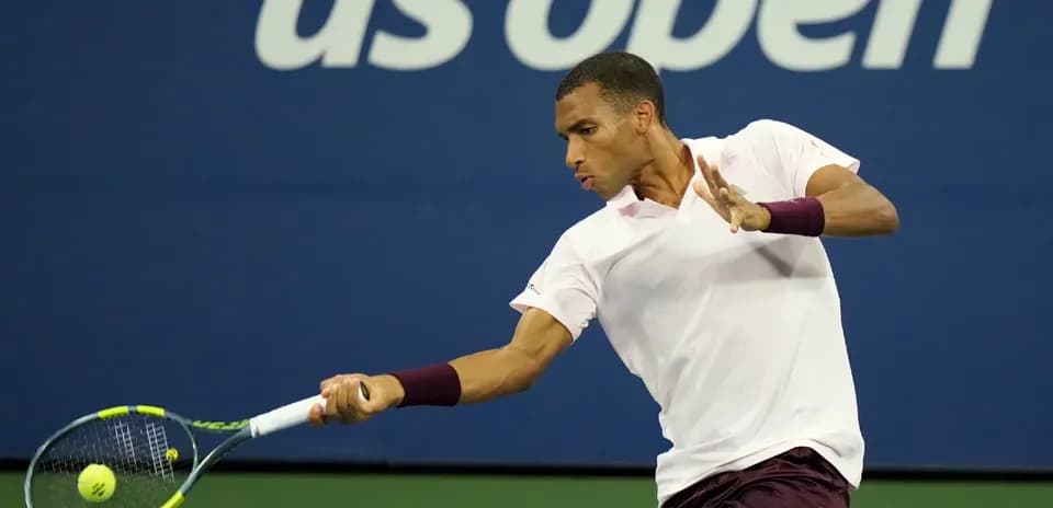 Player hitting a backhand during US Open match