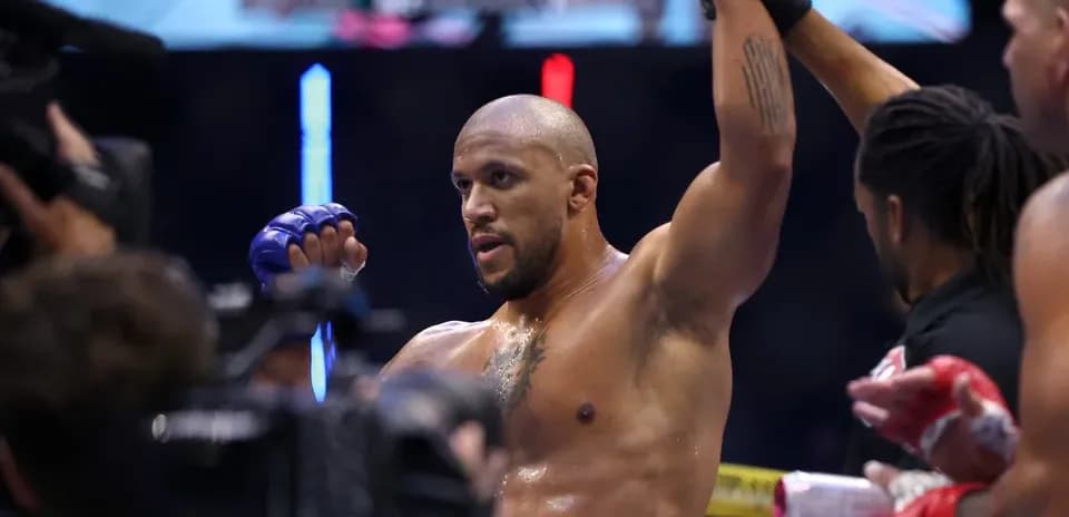 Fighter celebrating victory in the octagon