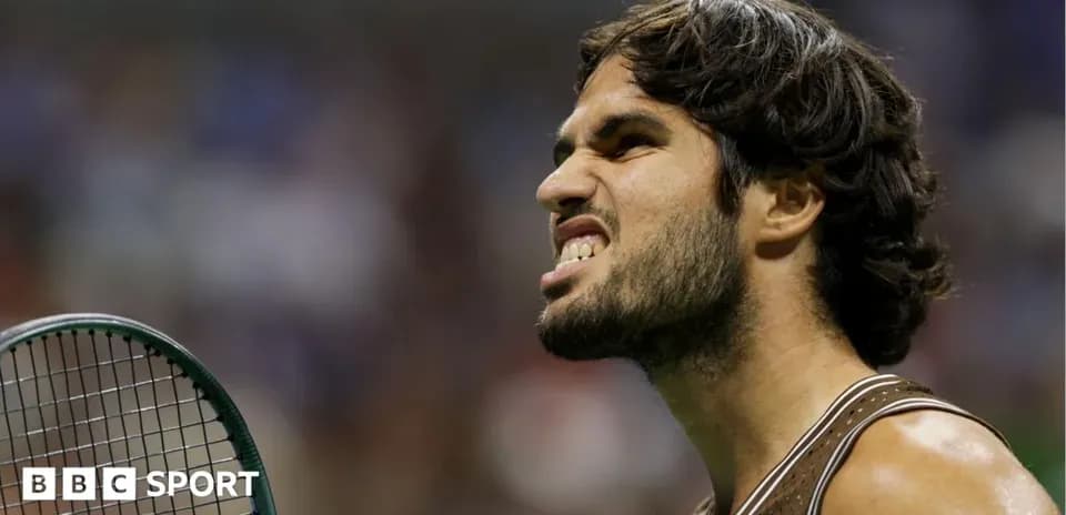 Tennis player celebrating with racket during match