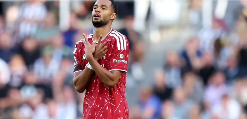 Player in red jersey gestures during match