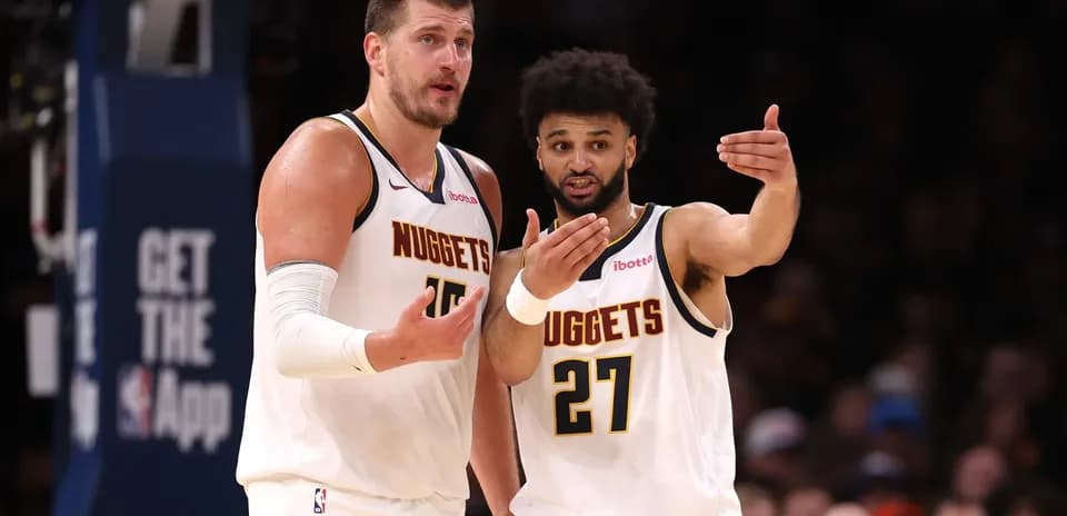 Nuggets players discussing strategy during game