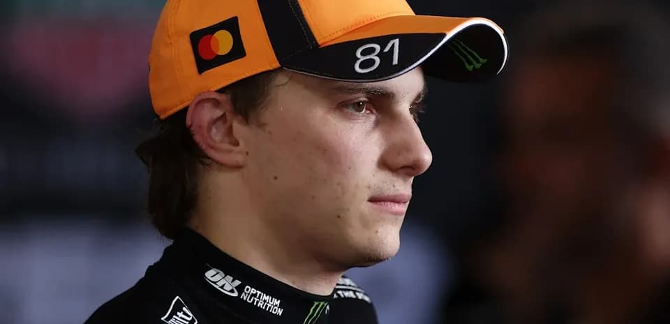 Driver wearing cap during press event