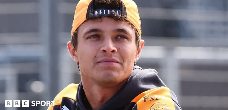 Driver wearing team gear during event preparation