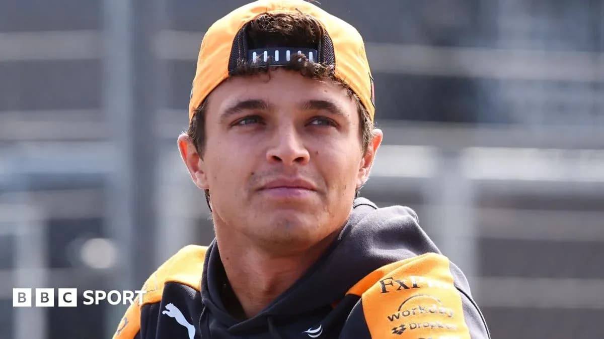 Driver wearing team gear during event preparation