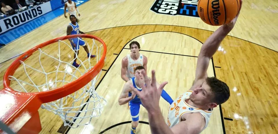 Player dunking the basketball during NCAA tournament