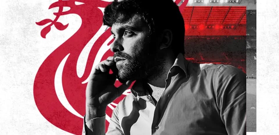 Man talking on phone with Liverpool logo background