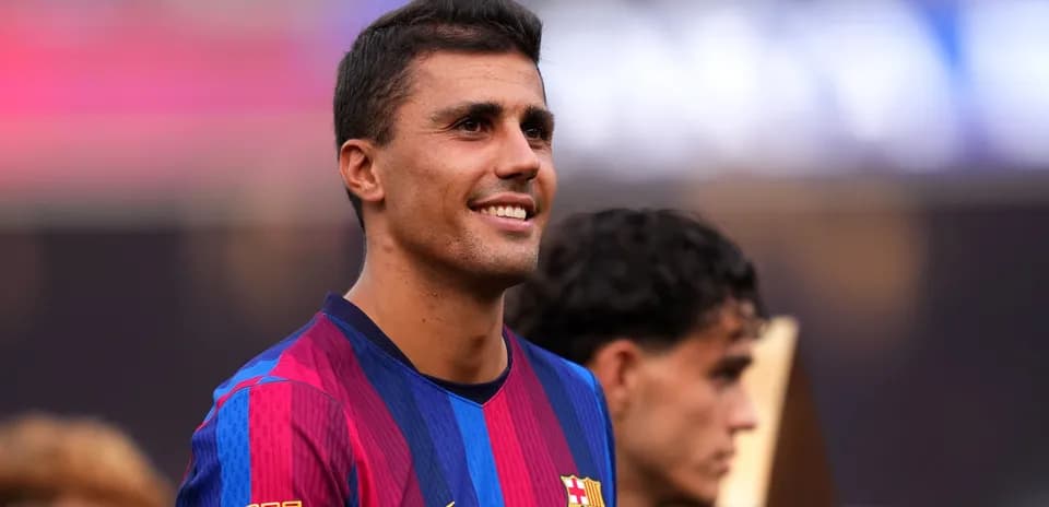 Player smiling in FC Barcelona jersey during event