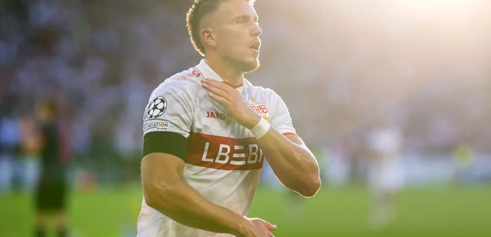 Player celebrating with hand on chest after match