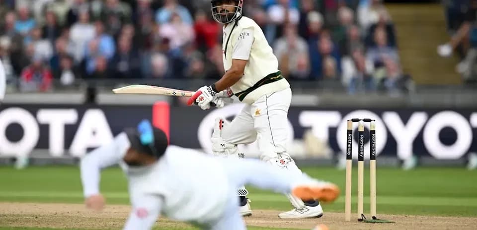 Batsman playing a shot during a cricket match